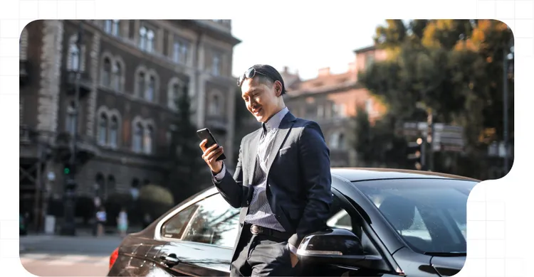Man with a phone searching a carshing platform