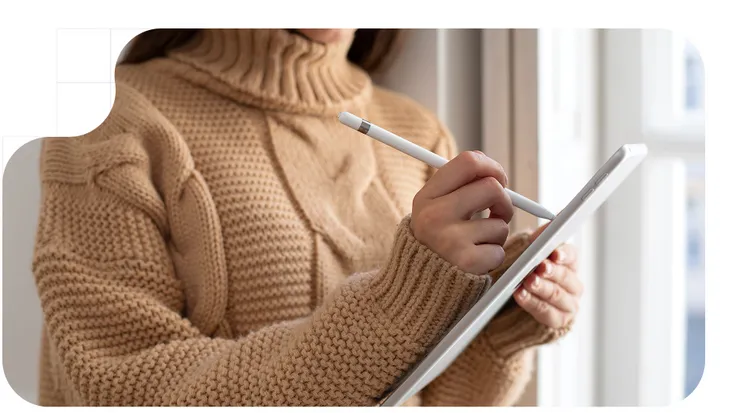 Woman signing a document in a tablet
