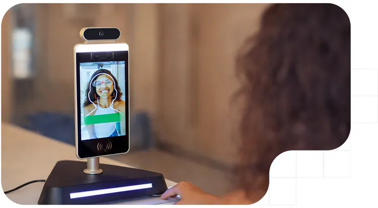Woman using a facial recognition system.