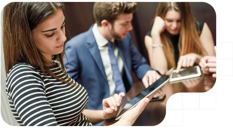 People reviewing digital documents for handwritten signature on a tablet
